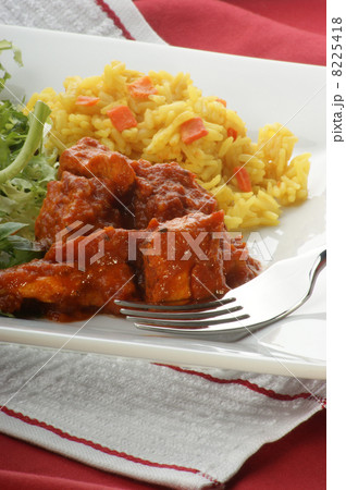 chicken curry with organic rice on a plate chicken curry with organic rice on a plate 8225418