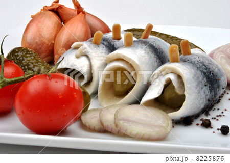 some fresh organic rollmops with tomato and onion 8225876