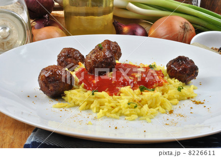 meatballs with organic curry rice on a plate 8226611