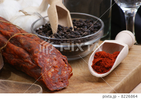salami and some spice on a timber board salami and some spice on a timber board 8226864