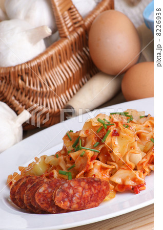home made noodle with some slices paprika salami home made noodle with some slices paprika salami 8226938