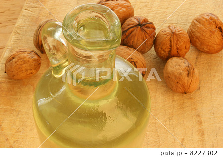 organic walnut oil in a glass bottle 8227302