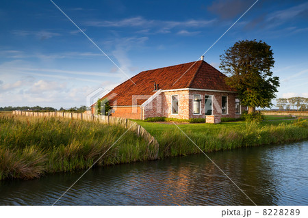 charming farmhouse in sunlight charming farmhouse in sunlight 8228289