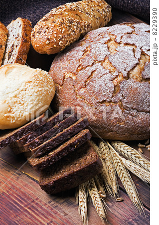 fresh bread and rolls with ears of wheat 8229390