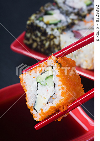 chopsticks hold fresh roll 8229392