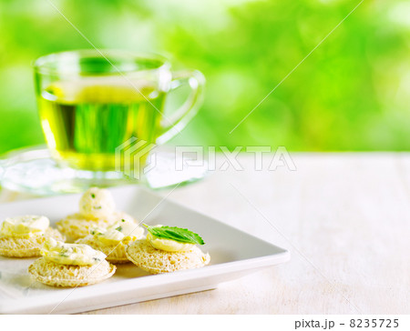 Several canapes and cup of herbal tea. Several canapes and cup of herbal tea. 8235725