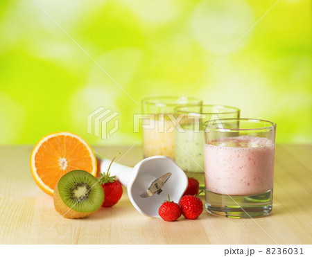 Fruit smoothie on wooden table on narural background Fruit smoothie on wooden table on narural background 8236031