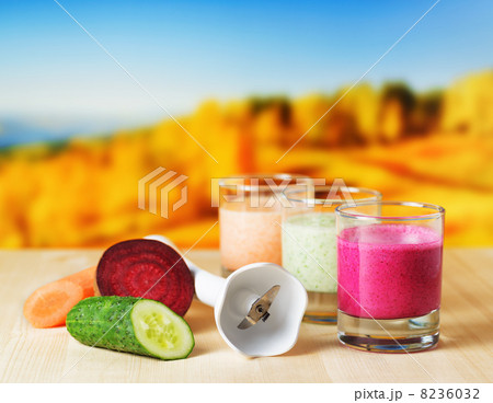 Vegetable smoothie on wooden table on natural background 8236032