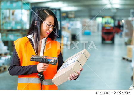 worker scans package in warehouse of forwarding worker scans package in warehouse of forwarding 8237053