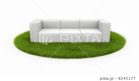 White sofa on green field 8245177