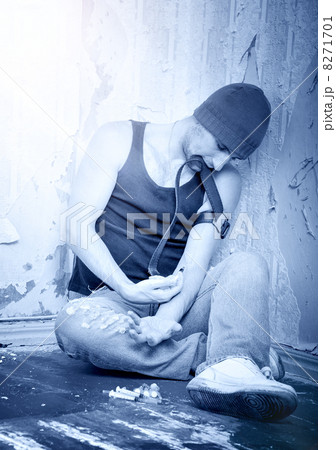 addict with syringes and  with drugs 8271701