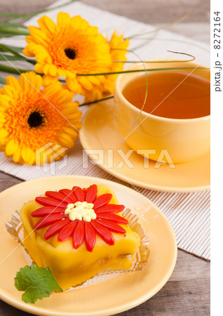 tea with cake and gerberas flowers tea with cake and gerberas flowers 8272164