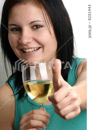 a young woman drinks home made wine 8281443