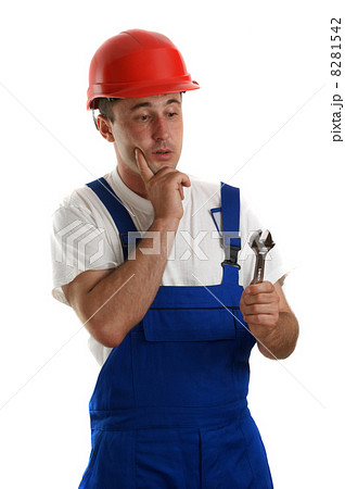 Craftsmen with safety helmet holding a wrench Craftsmen with safety helmet holding a wrench 8281542
