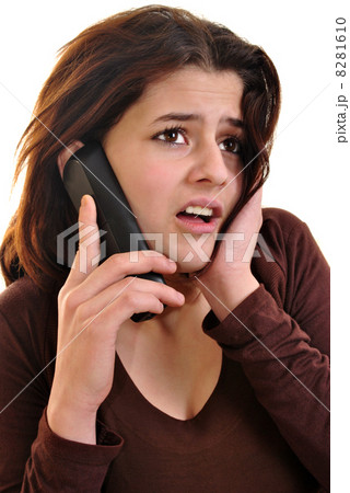 young woman is talking on a phone young woman is talking on a phone 8281610