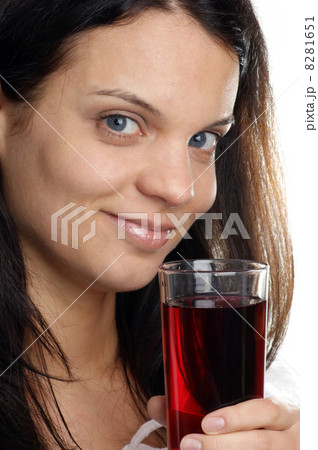 Cherry juice is consumed from a glass 8281651