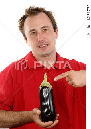 young man with an eggplant in his hand 8281772