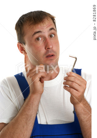 Craftsmen in blue overalls holding an allen key 8281869