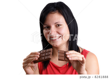 a young woman holds some sweet chocolate a young woman holds some sweet chocolate 8281888