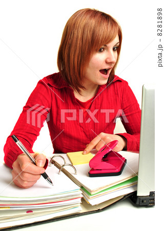 Office assistant in a red blouse makes notes 8281898