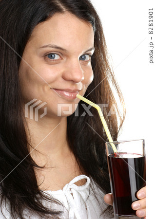 Cherry juice is consumed from a glass 8281901