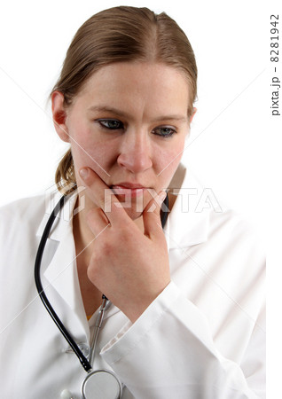 young medical assistant in a white uniform is thoughtfully 8281942