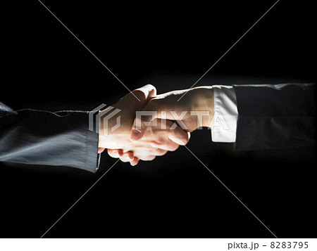 Handshake Handshaking on light and dark Handshake Handshaking on light and dark 8283795