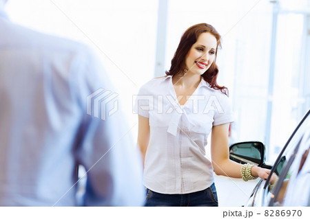 Young woman at car salon Young woman at car salon 8286970