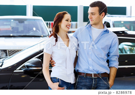 Young happy couple at car salon Young happy couple at car salon 8286978