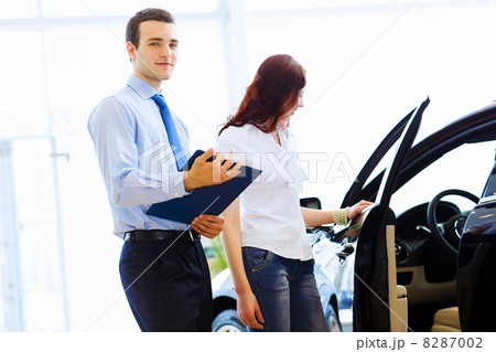 Young woman at car salon 8287002