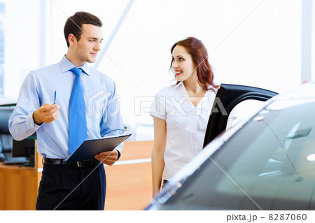 Young woman at car salon Young woman at car salon 8287060