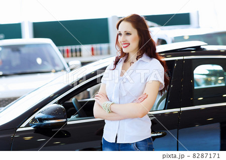 Young lady at car salon Young lady at car salon 8287171