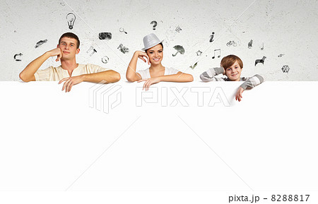 Happy young family with blank banner 8288817