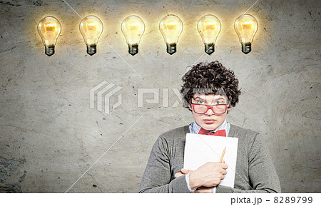 Young man with papers and light bulb Young man with papers and light bulb 8289799