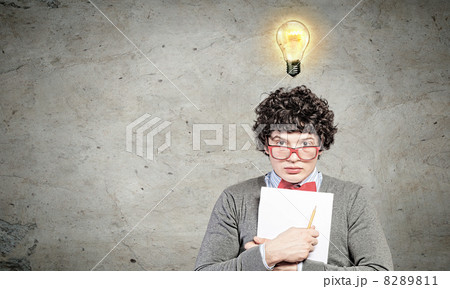 Young man with papers and light bulb Young man with papers and light bulb 8289811