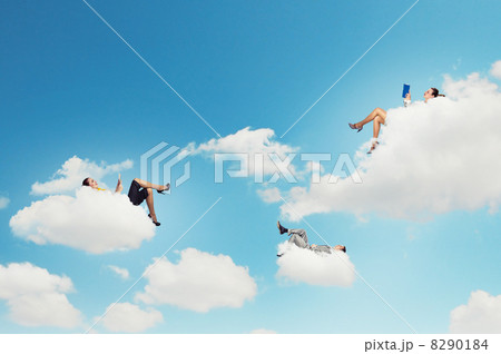 Business people lying on clouds Business people lying on clouds 8290184