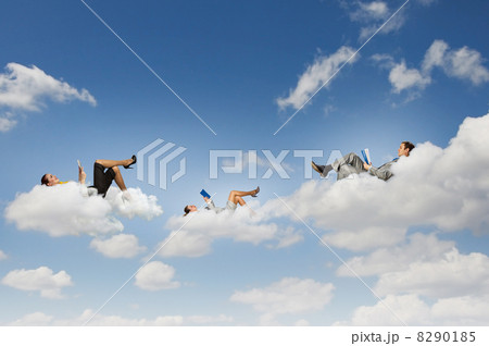Business people lying on clouds 8290185