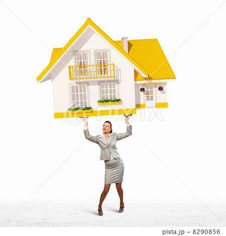 Businesswoman holding model of house Businesswoman holding model of house 8290856