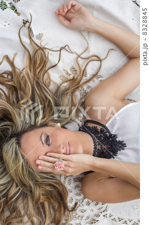 Beautiful girl covering her eye with a hand 8328845