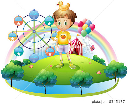 A boy with a rubber duck in an island with a carnival A boy with a rubber duck in an island with a carnival 8345177