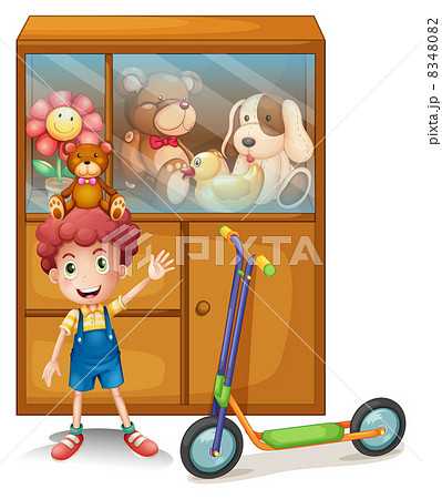 A boy and his scooter in front of his toy collections 8348082