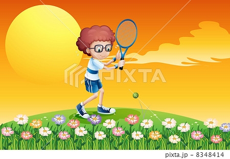 A boy playing tennis at the hill A boy playing tennis at the hill 8348414