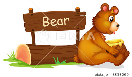 A bear sitting beside a wooden signage 8353069
