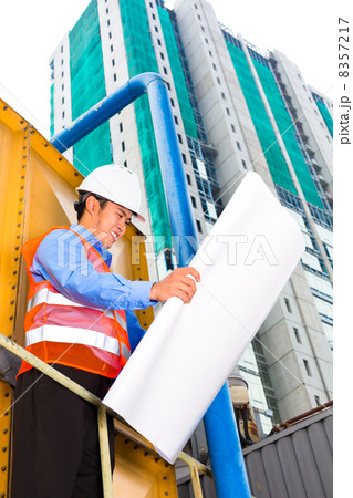 Asian worker or supervisor on building site 8357217