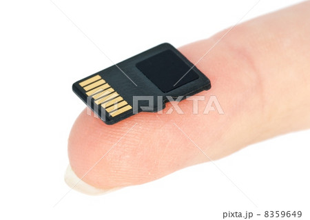 Tiny flash memory card on fingertip 8359649