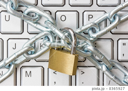 Locked chain on computer keyboard 8365927