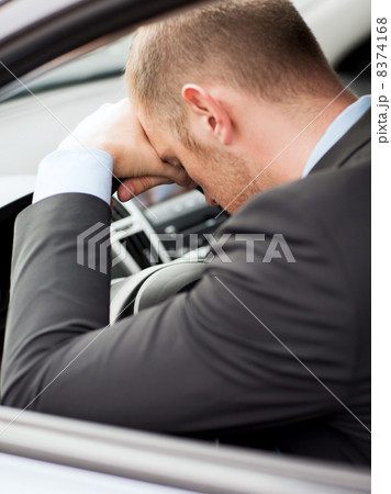 tired businessman or taxi car driver tired businessman or taxi car driver 8374168