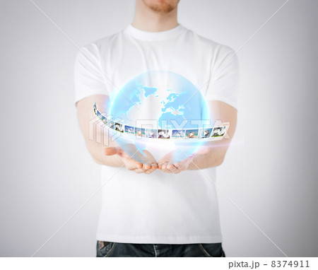 man with virtual globe and news man with virtual globe and news 8374911
