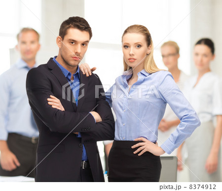 businessman and businesswoman in the front of team businessman and businesswoman in the front of team 8374912