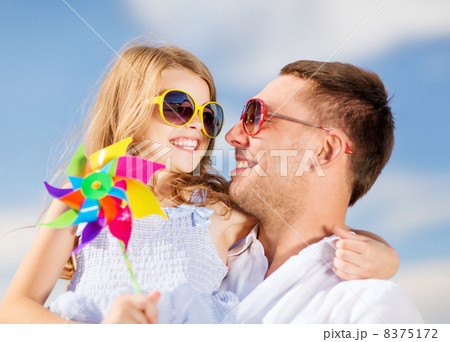 happy father and child in sunglasses over blue sky 8375172
